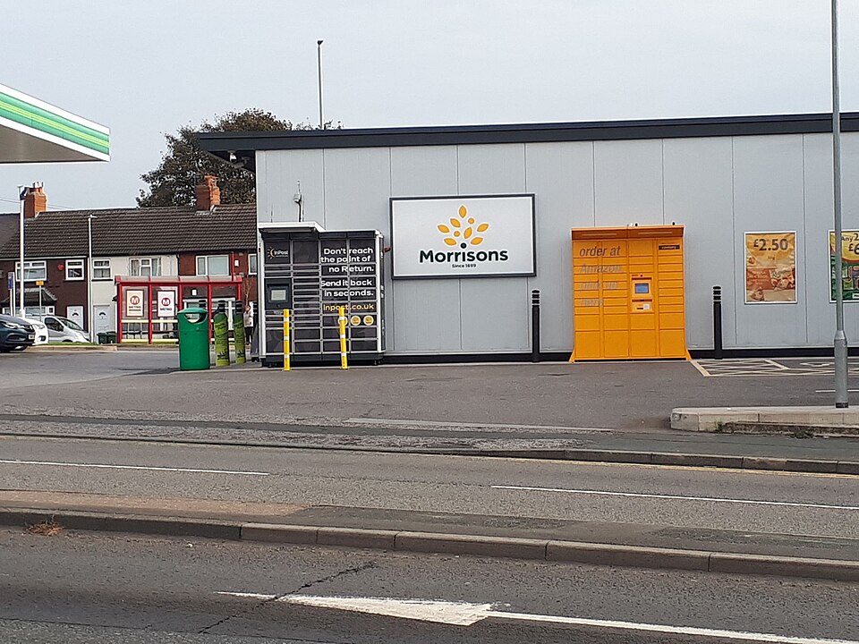 Rival parcel locker networks side by side at a UK supermarket forecourt — the battle for retail PUDO locations
